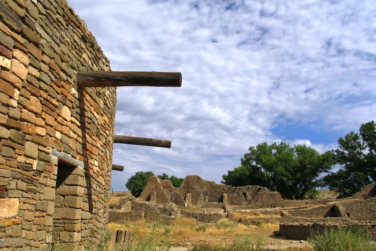 Reconstructed stone kiva amidst stone ruins