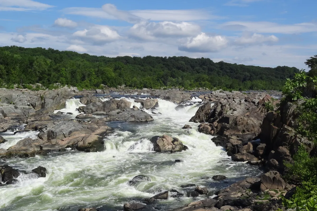 The rushing river cascades over the rocks of the Potomac