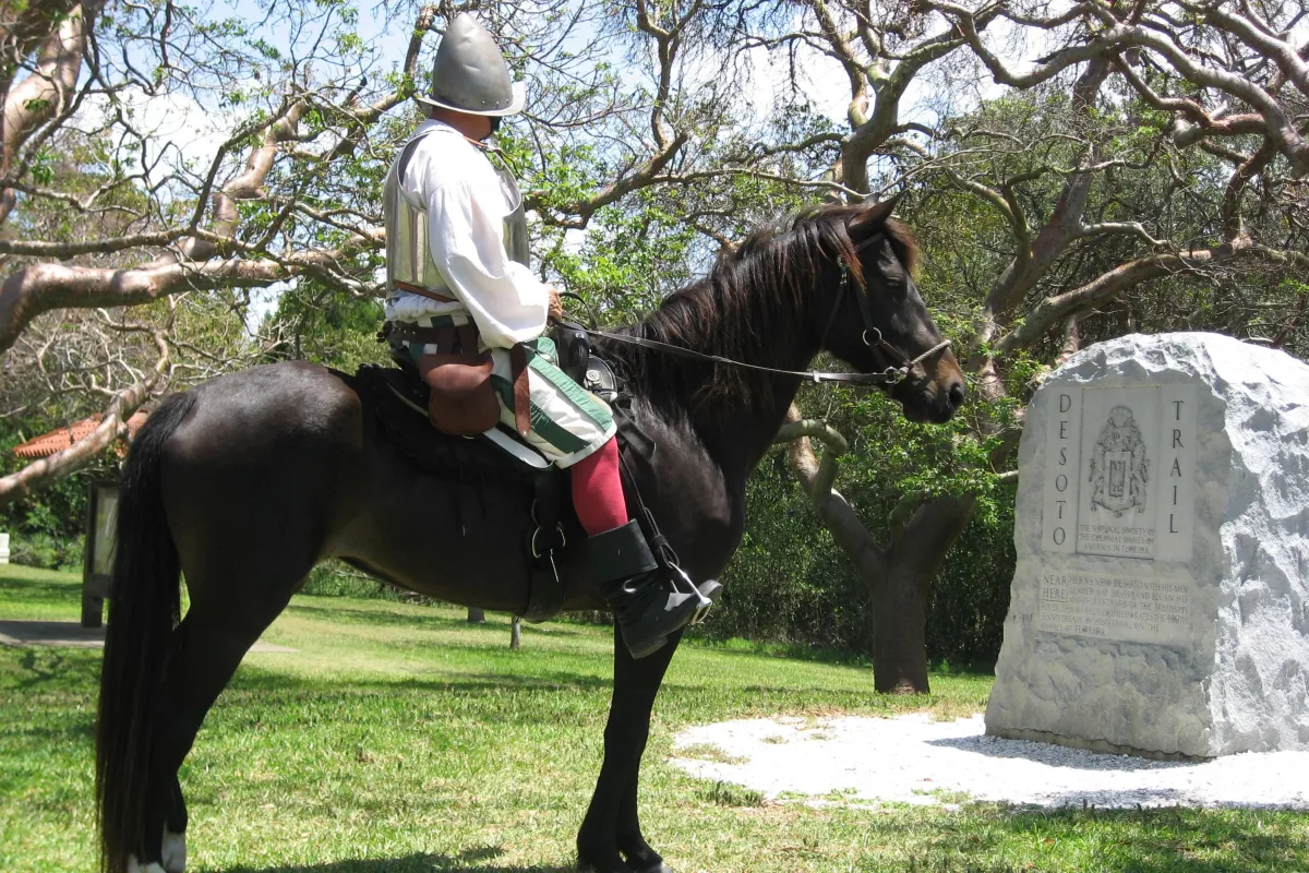 Reenactor Bill Boston on his horse Dixie in front of the De Soto Monument.