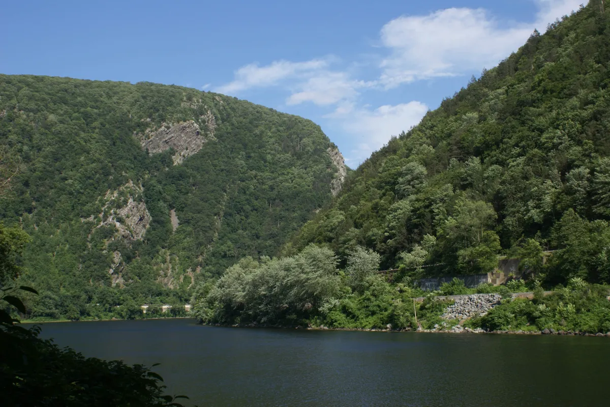 View of the Delaware River cutting between two low mountain peaks
