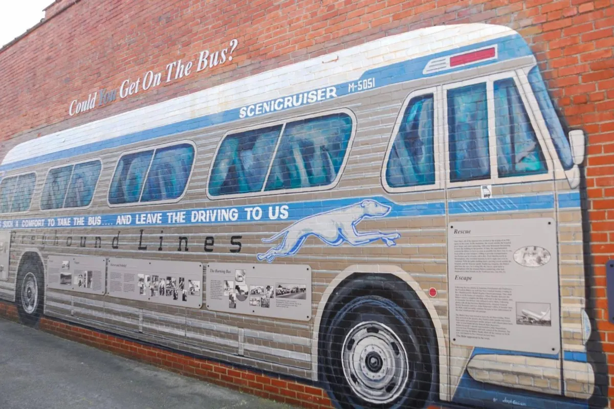 Colored Greyhound mural with historical information about the Freedom Riders