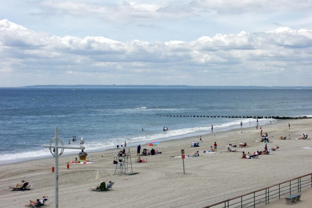 Visitors enjoying the sun and sand at Jacob Riis Park