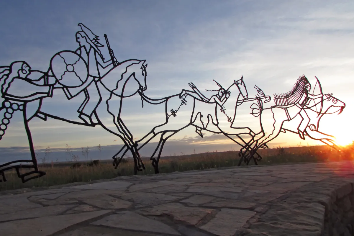 The sun sets behind the Indian Memorial.