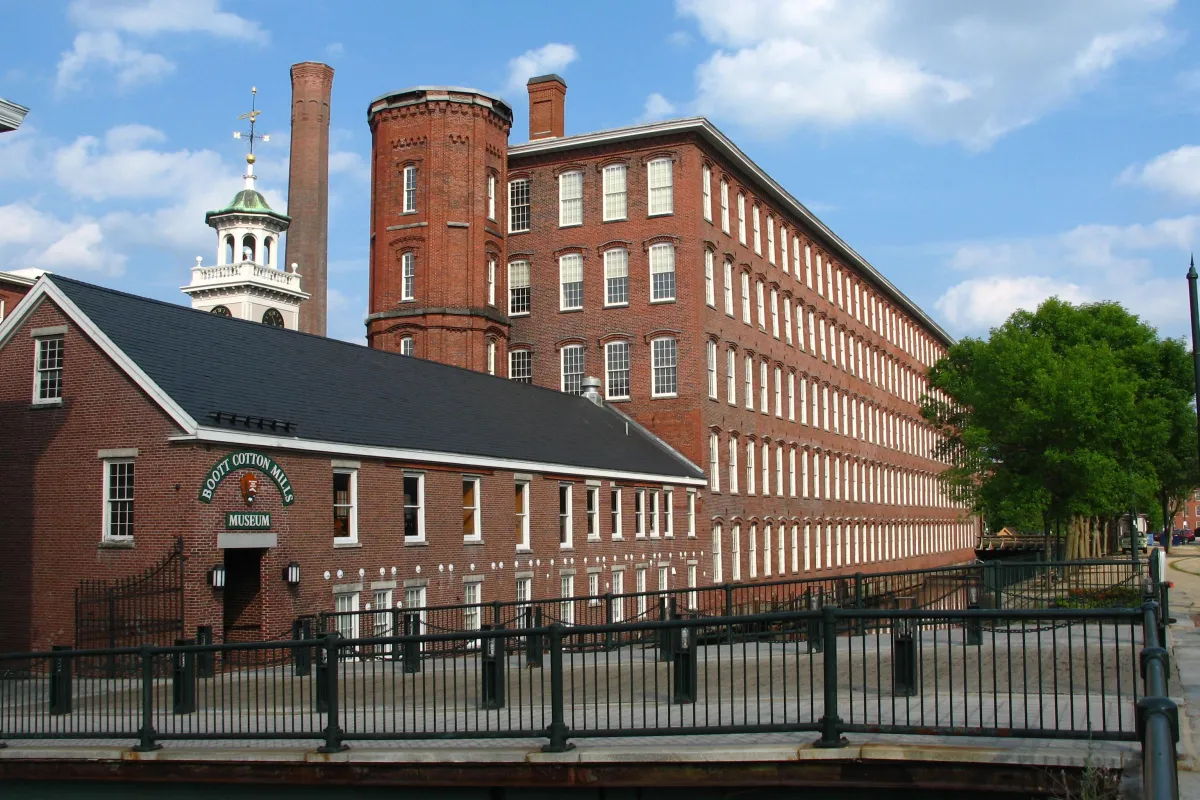 5 story brick factories with a clocktower surrounding a central courtyard
