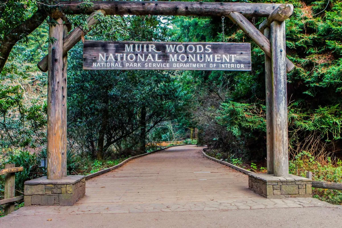 Wooden sign and entrance to Muir Woods National Monument